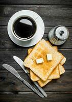 Breakfast. Toasted bread with butter and aromatic coffee. photo
