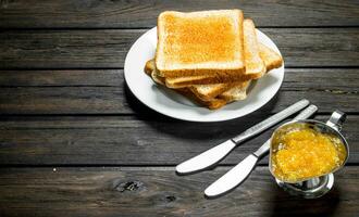 Breakfast. Toasted bread with fruit jam. photo