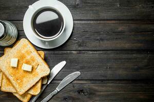 Breakfast. Toasted bread with butter and aromatic coffee. photo