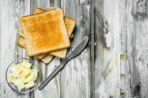 Breakfast. Toasted bread and butter . photo