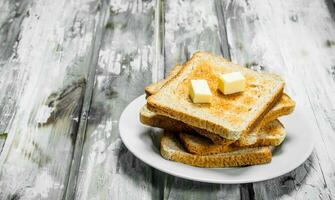 Breakfast. Toasted bread and butter . photo