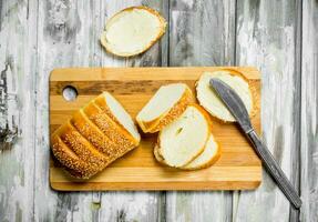 Fresh bread and butter on the Board . photo