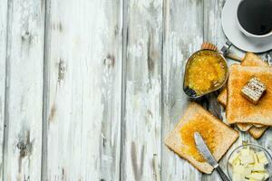 Breakfast. Toasted bread with orange jam . photo