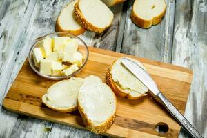 Fresh bread and butter on the Board . photo