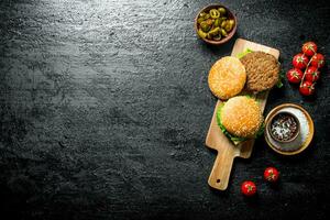 Burgers with jalapeno chillies and tomatoes. photo