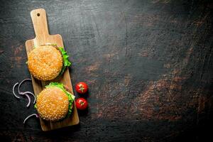 Burgers with beef and onion slices. photo