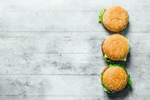 Burgers with beef, vegetables and cheese. photo