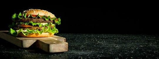 Burger with beef and vegetables. photo