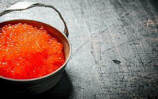 Red caviar in the bowl. photo