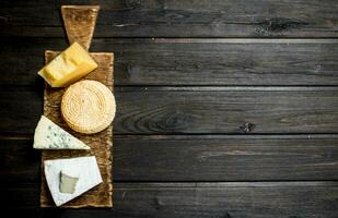 Different types of cheese on the cutting Board. photo