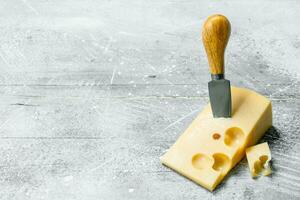 Fresh cheese with knife. photo