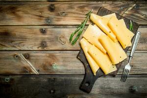 Thin slices of rosemary cheese. photo