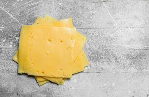 Thin slices of cheese. photo