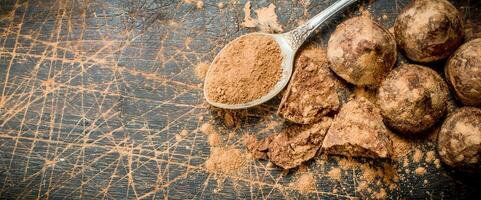 Chocolate candy truffles with cocoa powder. photo