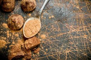 Chocolate candy truffles with cocoa powder. photo