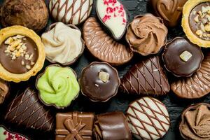 Chocolates candies with different fillings. photo