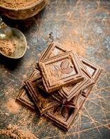 Chocolate slices with cocoa powder. photo
