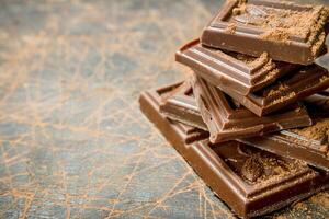 Chocolate slices with cocoa powder. photo