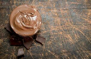 Chocolate paste in bowl . photo