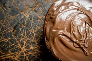 Chocolate paste in bowl . photo