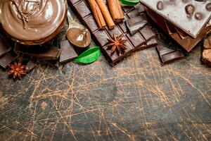 Chocolate paste with cinnamon and chocolate slices. photo