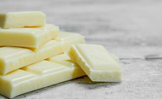 Pieces of white chocolate. photo