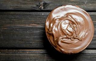 Chocolate paste in bowl. photo