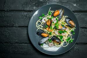 Mediterranean food. Seafood spaghetti with clams. photo