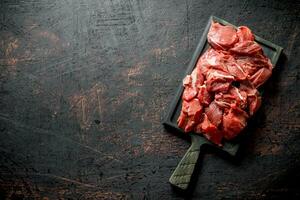 Sliced raw beef on a cutting Board. photo