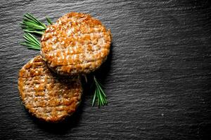 Cutlets and rosemary. photo