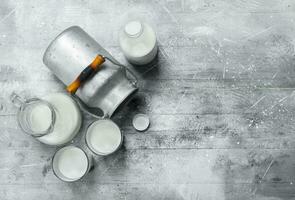 Fresh milk in glasses with a can. photo