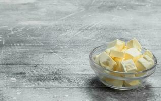 Butter in a glass bowl . photo