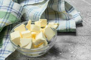 Butter in a glass bowl with napkin . photo