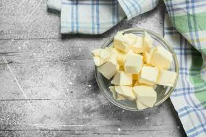 Butter in a glass bowl with napkin . photo