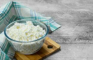 Cottage cheese in bowl on napkin. photo