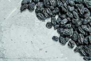 Delicious raisins. On a rustic background. photo