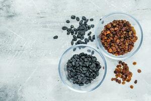 Raisins in glass bowls. photo