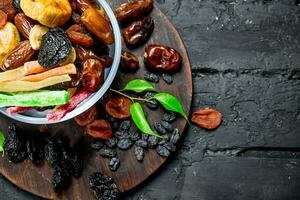 Different dried fruit in a bowl. photo