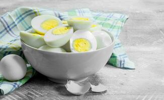 Boiled eggs in bowl. photo