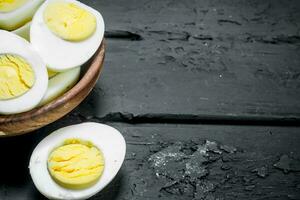 Boiled eggs in bowl. photo