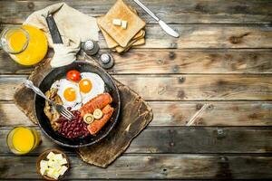 traditional English breakfast. Appetizers with fried bread and orange juice. photo