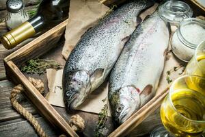 Raw sea fish salmon with white wine and thyme. photo