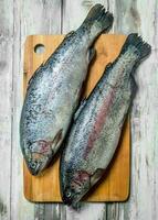 Raw fish salmon on a cutting Board. photo