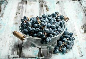 black grapes in saucepan. photo