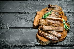 Grilled sliced beef steak with rosemary. photo
