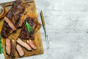 Grilled beef steak with rosemary and spices. photo