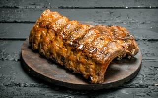 Grilled ribs on a cutting Board. photo