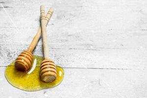 Natural honey with a wooden spoon. photo