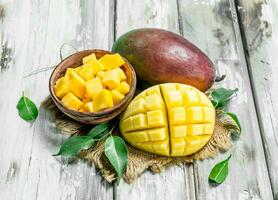 Mango slices in a bowl on napkin. photo