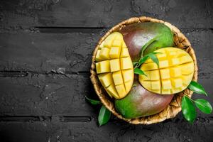 Aromatic fresh mango in a basket. photo